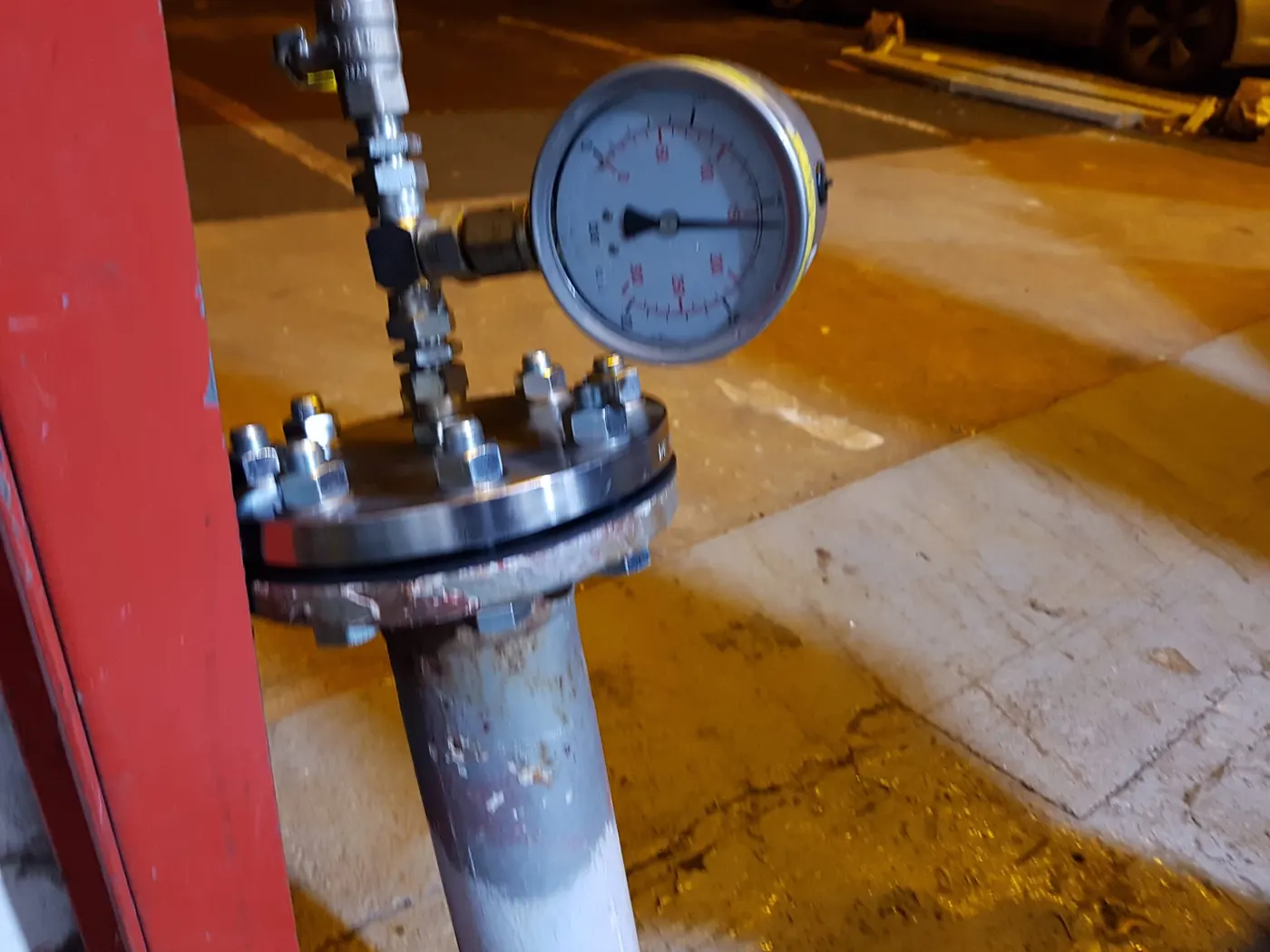 Pressure testing gauge and manifold connected to pipework